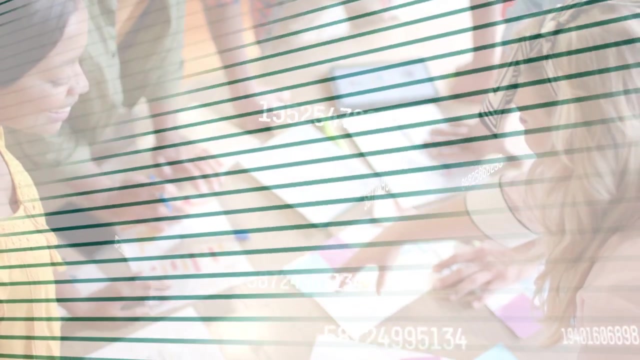Camera panning down, team leaning over table, rearranging notes, tapping tablet, planning project