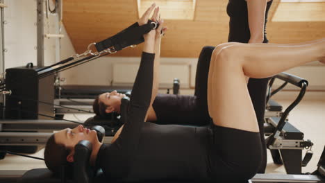 pilates reformer workout with instructor