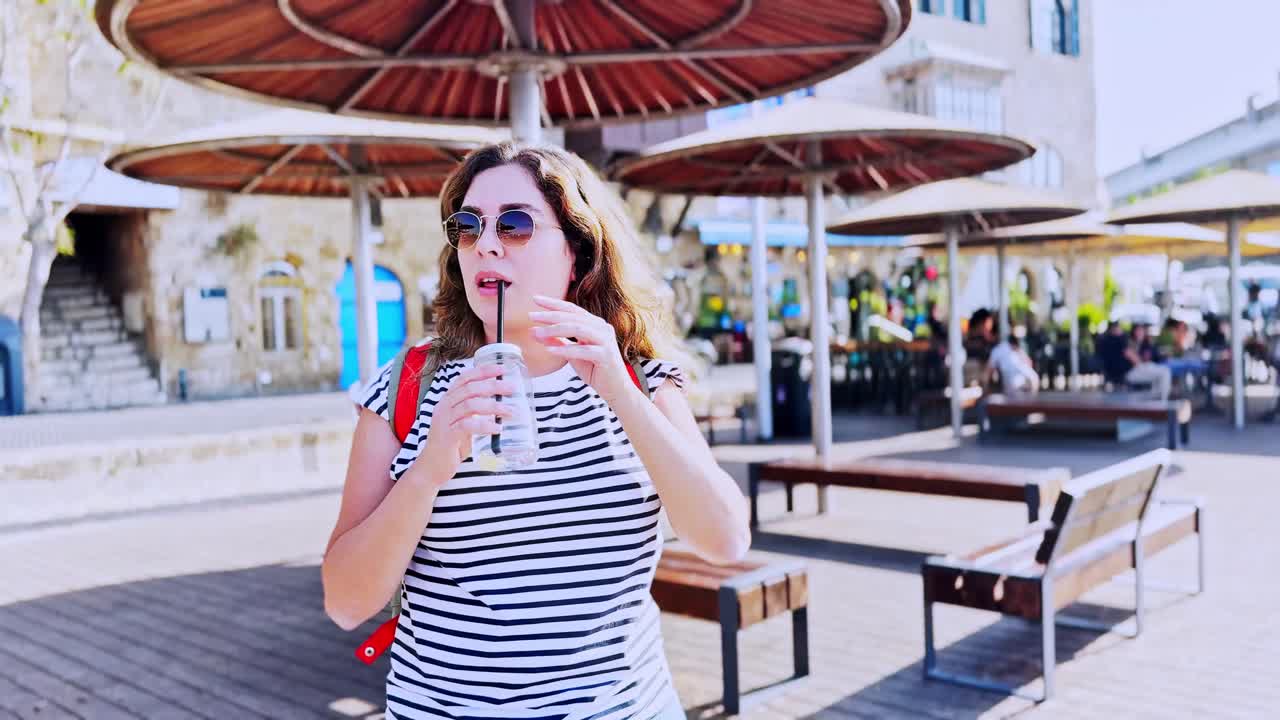 Tourist Woman Drinking Refreshing Beverage At Jaffa Port