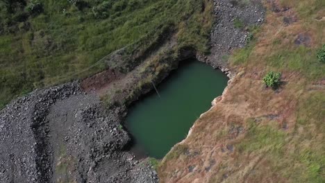 aerial: sustainable forest plantation in a valley with artificial lakes to water the plants in india