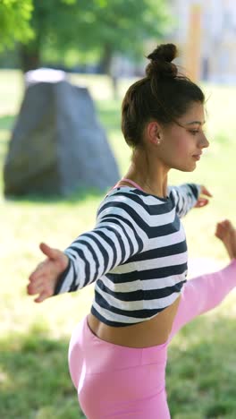 woman practicing yoga in a park