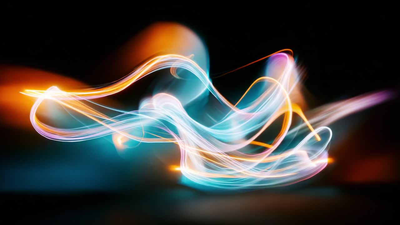 Captivating Abstract Light Trails Dance Across the Frame, Creating a Spectacular Display of Colorful Swirls and Luminescent Shapes in a Dark Environment