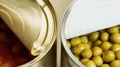 open cans of canned beans and peas
