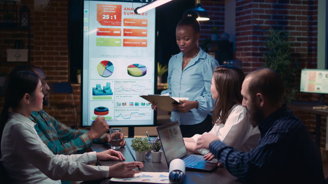 Employee speaking in business meeting presentation, holding report clipboard