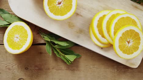 overhead of sweet limes with glasses of juice