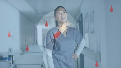 병원에서 아시아 여성 의사 위에 혈액 방울과 주사기의 애니메이션