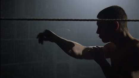 boxing training session in a dark gym