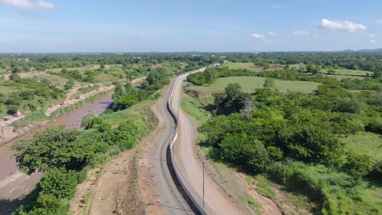 Aerial view of Border fence between the Dominican Republic and Haiti in Dajabon, Dominican Republic