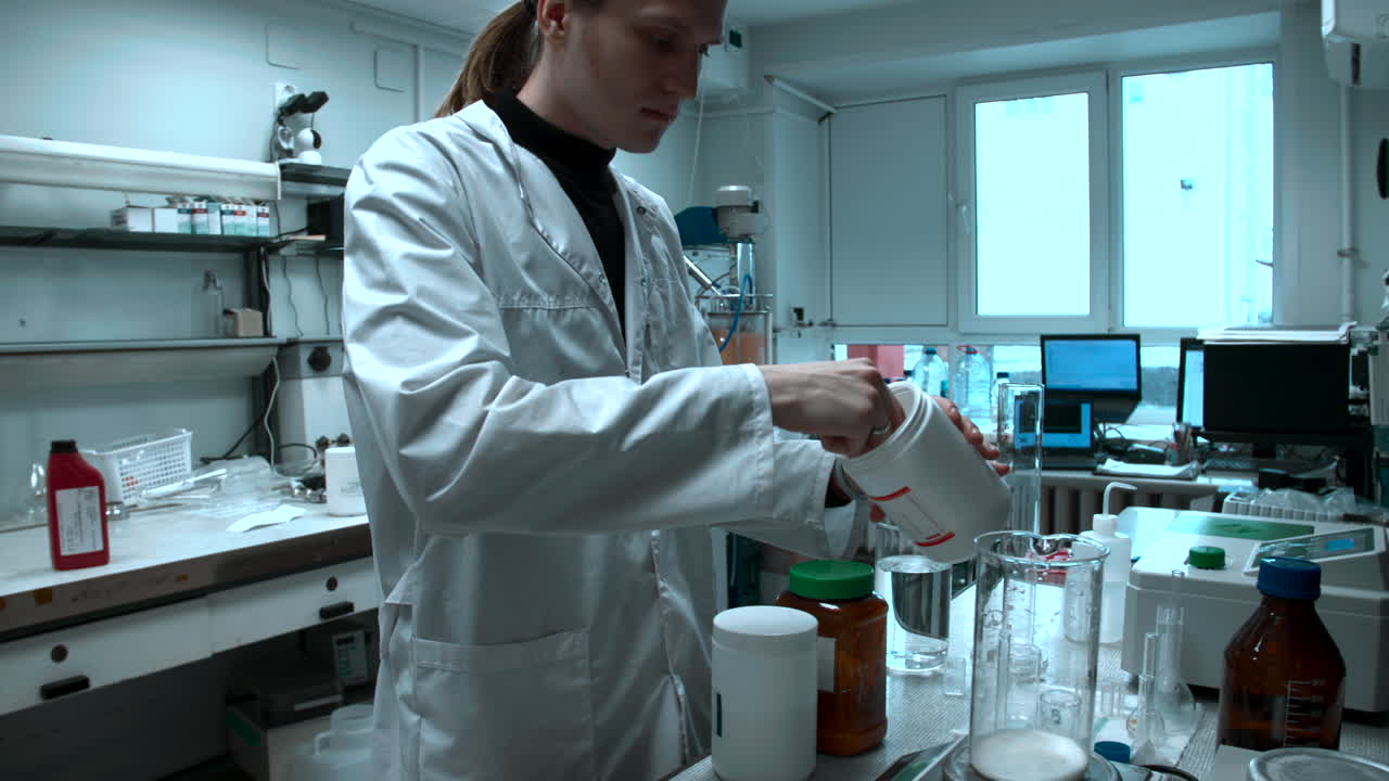 Young Scientist Measuring White Powder in a Laboratory Beaker