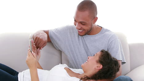 cute couple looking at ultrasound scan of baby