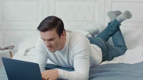 concentrated business man getting negative news on computer at remote workplace.