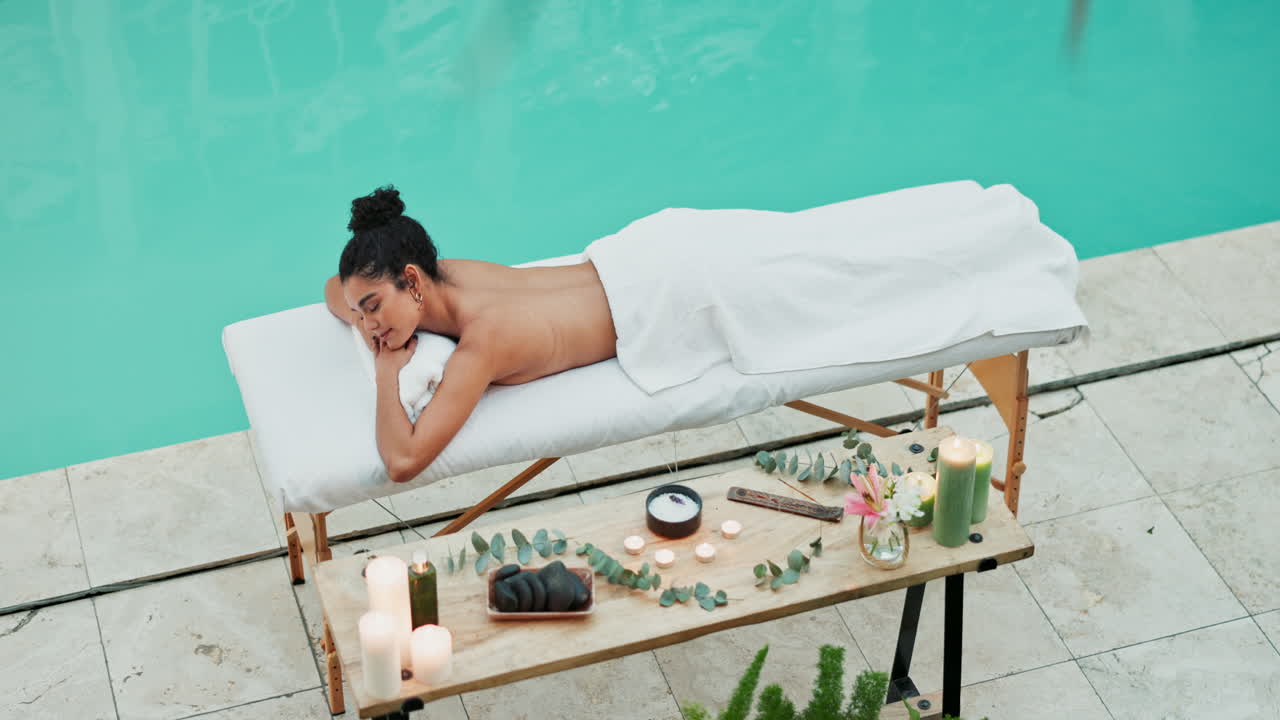 Woman Relaxing by the Pool at Spa