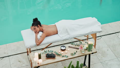woman relaxing by the pool at spa