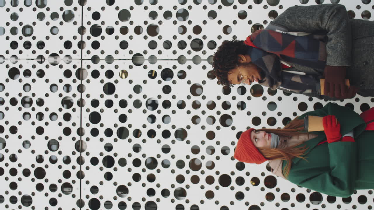 Couple Talking Outdoors in Winter