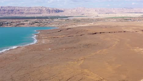 aerial view of the dead sea landscape with sinkholes and arid mountains