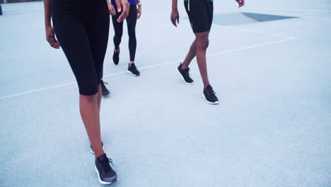 group of people walking on a track