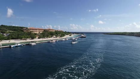 drone view of a hotel resort and marina with small yachts in curaçao