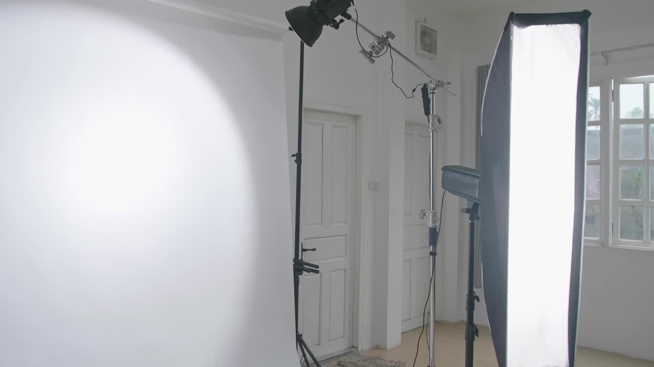 Empty Photo Studio With Lighting Equipment