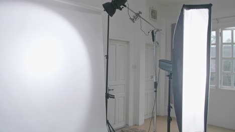 empty photo studio with lighting equipment