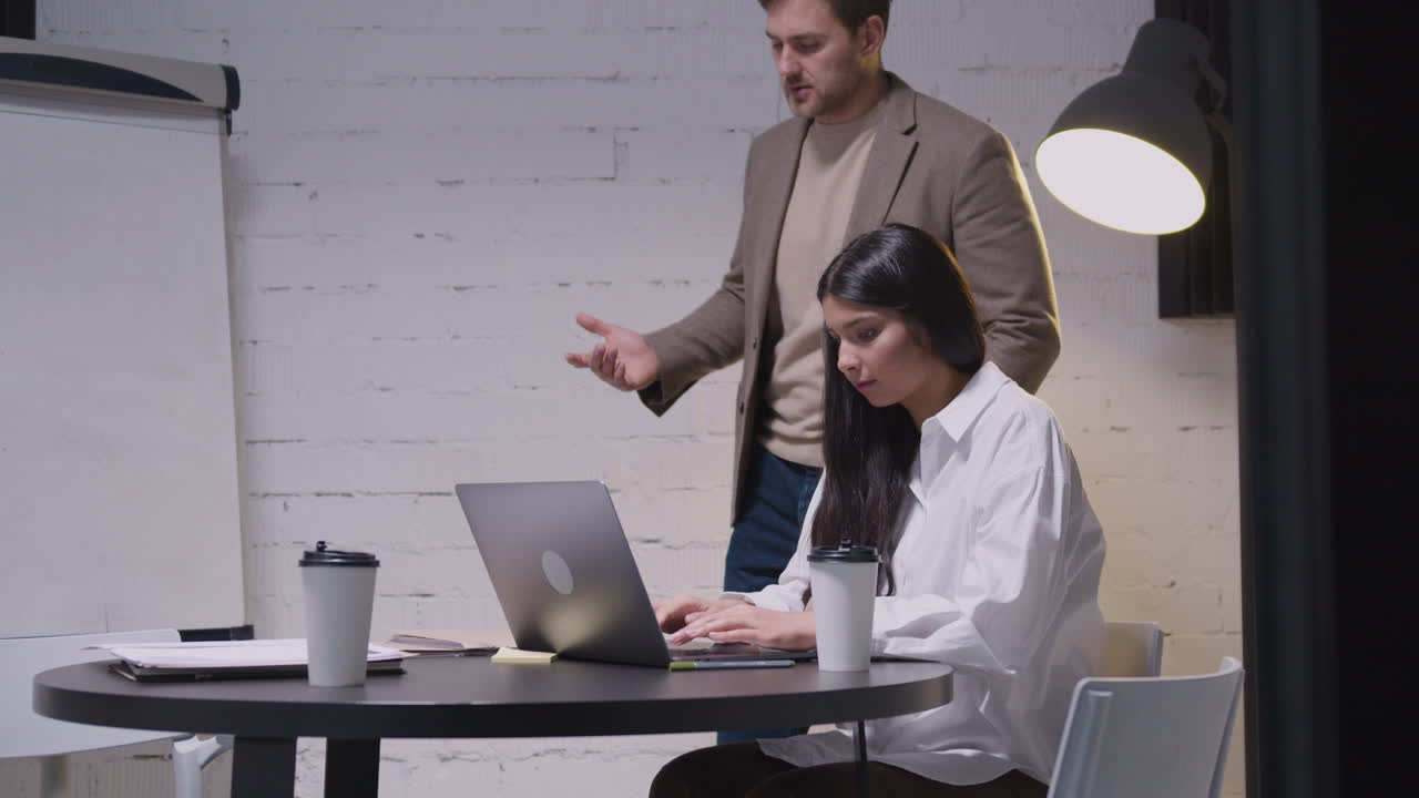 Man And Woman Having A Business Meeting In Boardroom 4