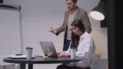 Man-And-Woman-Having-A-Business-Meeting-In-Boardroom-4