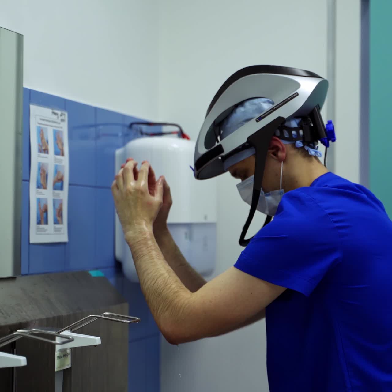 Doctor washing hands at clinic