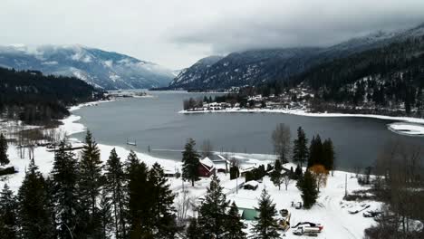 Aerial-Drone-Flight-Over-Winter-Wonderland-of-Adams-Lake-and-Snow-Covered-Mountains