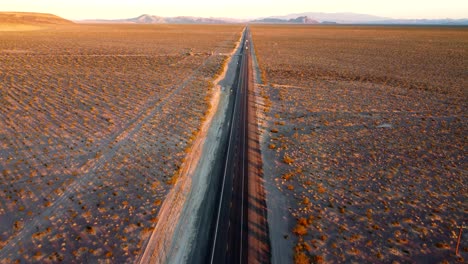 us, nv, amargossa valley, hwy 95, 2025-01-15 - drone view of the highway running straight into the distance at sunset surrounded by empty desert
