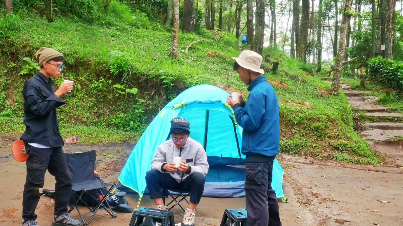 Friends enjoying camping trip with ukulele music and tent in nature's embrace