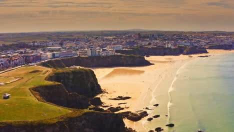 late afternoon aerial view over the private beaches of lusty glaze near newquay in cornwall