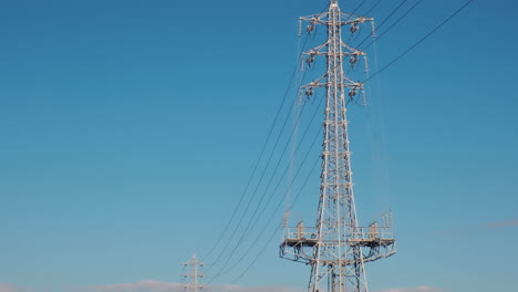 electrical net of poles against the blue sky