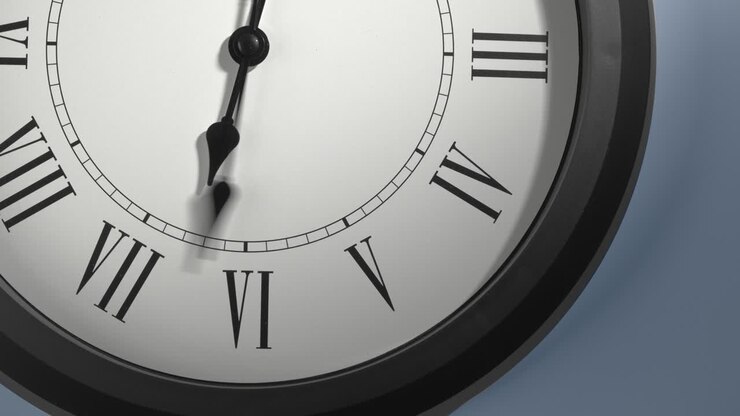 Latin Clock Face on Light Blue Wall in Time Lapse