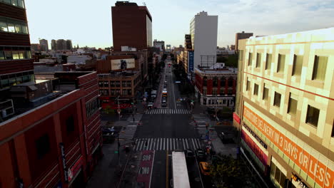 drone aerial flight small town high street center intersection traffic lights car