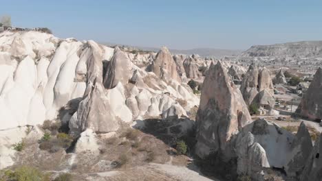 Aerial-view-from-drone-flying-through-a-valley-of-Cappadocia,-Turkey