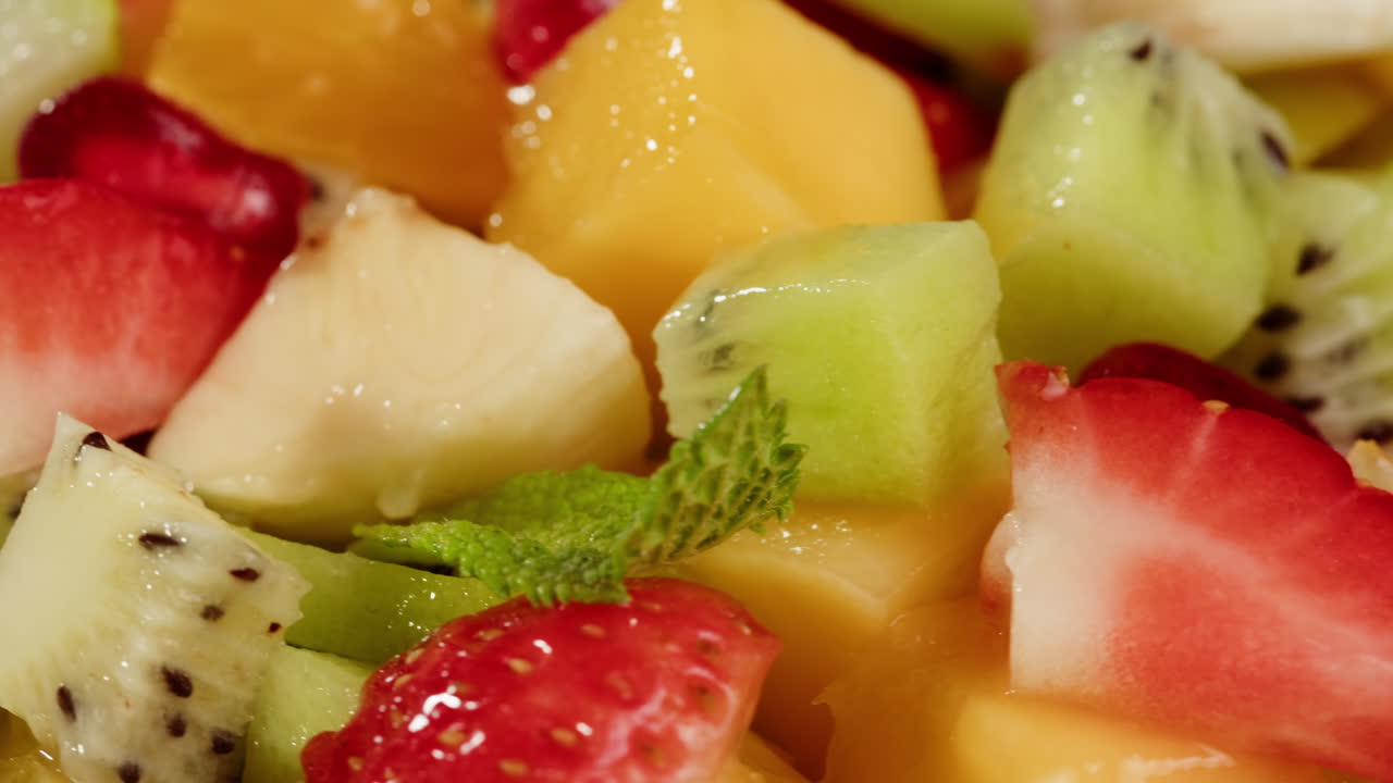 Close-Up Rotating View of Fresh and Colorful Diced Fruit Salad