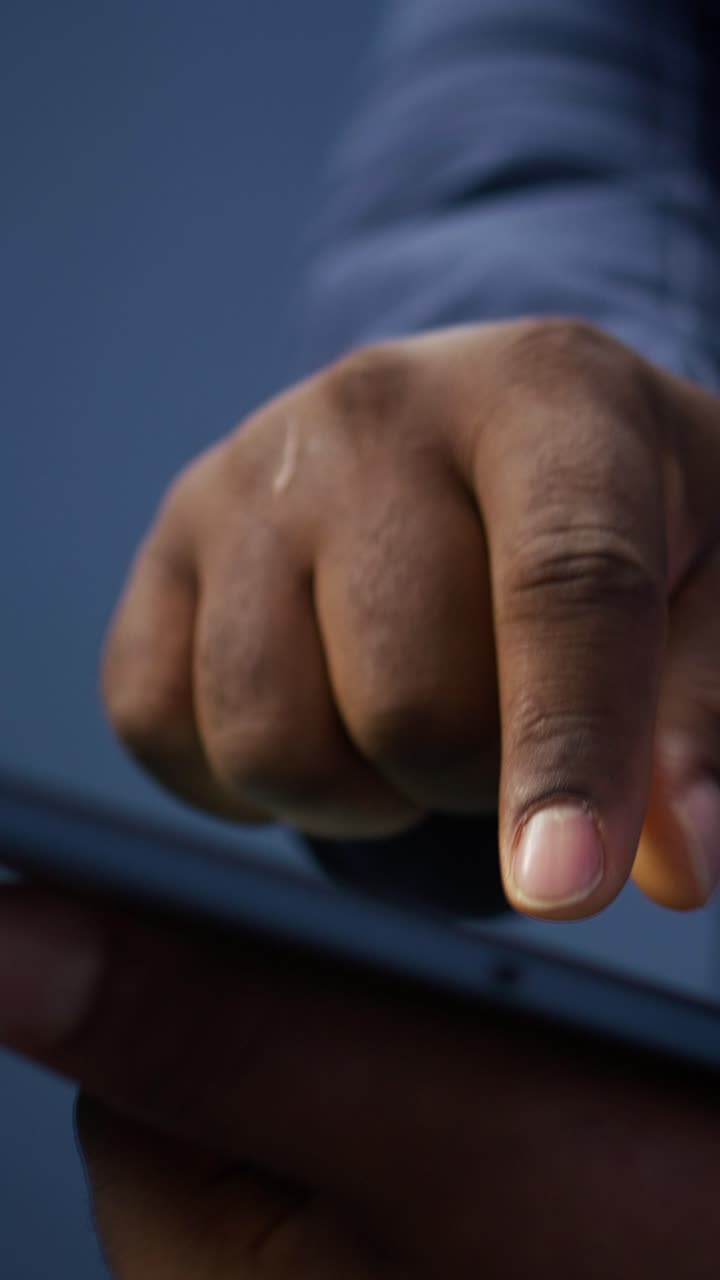 African American Hand Tapping and Swiping on Digital Tablet Screen
