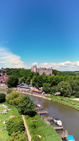 vertical video drone footage of arundel castle, river arun and historic town. 4k