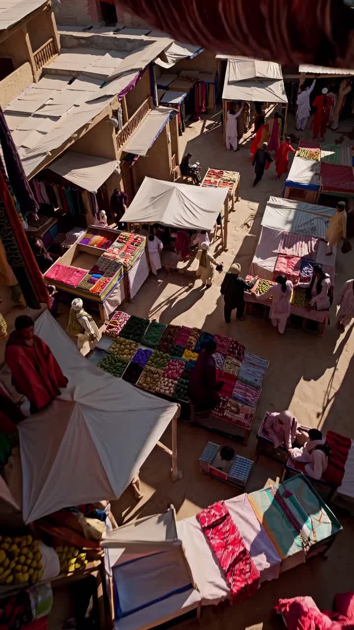 Aerial view of a vibrant textile market with colorful fabrics