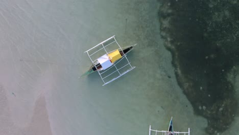 Drone-shot-of-the-beautiful-Paradise-Beach-coastline-in-Bantayan-Philippines-with-Baroto-boats-on-the-shore