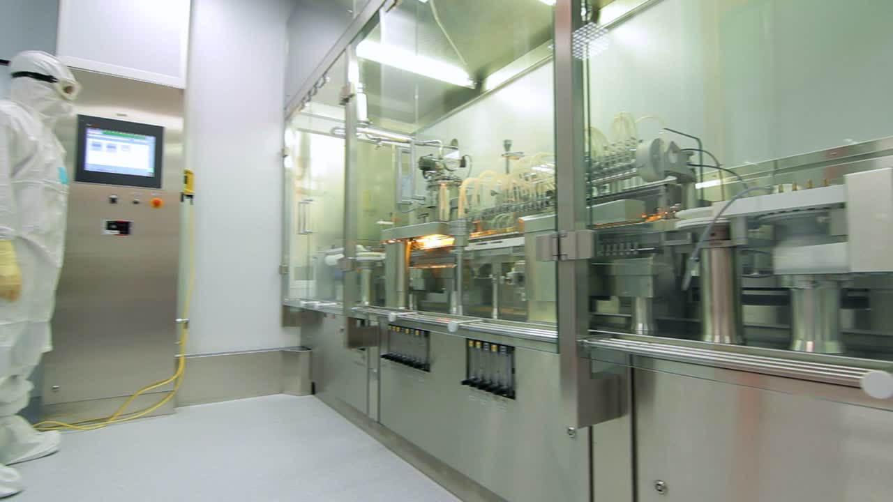Factory operator control automated production line. Pharmaceutical production