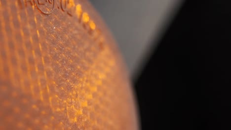 macro-video-of-a-motorcycle-light,-slide-left-movement