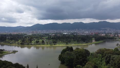 Drone-shot-moving-towards-the-city,-with-the-Monserrat-and-mountains-in-the-background