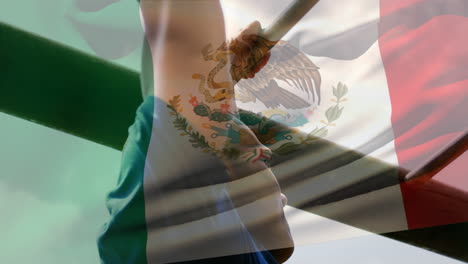 animation of flag go mexico over strong muscular man doing pull ups