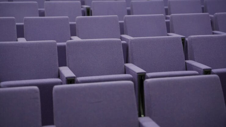 Empty seats in auditorium or theatre - no crowd sitting