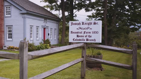 sign-and-full-wide-shot-of-the-Original-Home-of-the-Knights,-Joseph-Sr-and-Newel-Knight-and-where-the-first-branch-of-the-church-of-Christ,-Mormons-located-in-Colesville,-New-York-near-Bainbridge