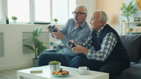 elderly men enjoying video games at home