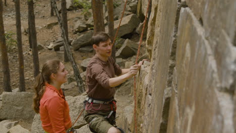 climbers at the bottom of the cliff