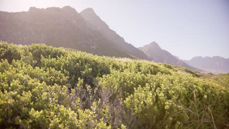 landscape of beautiful mountains and sea with blue sky on sunny day, in slow motion