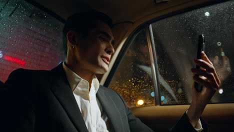 speaking businessman video calling telephone vehicle closeup. man gesturing hand