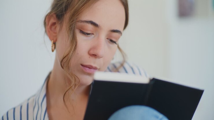 Woman Writing In Notebook Learning